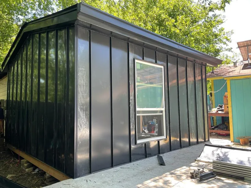 Black standing seam metal wall panels for Roof Inspection in Edwards